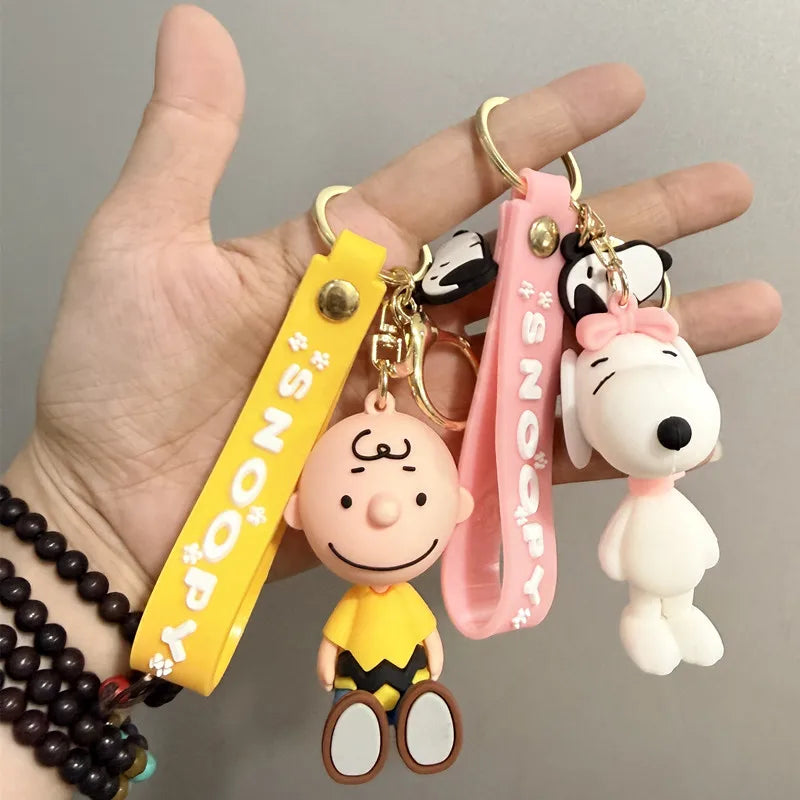 Cute and stylish new Snoopy cartoon dog design for 2026, can be used as a bag charm, backpack pendant, or car keychain.